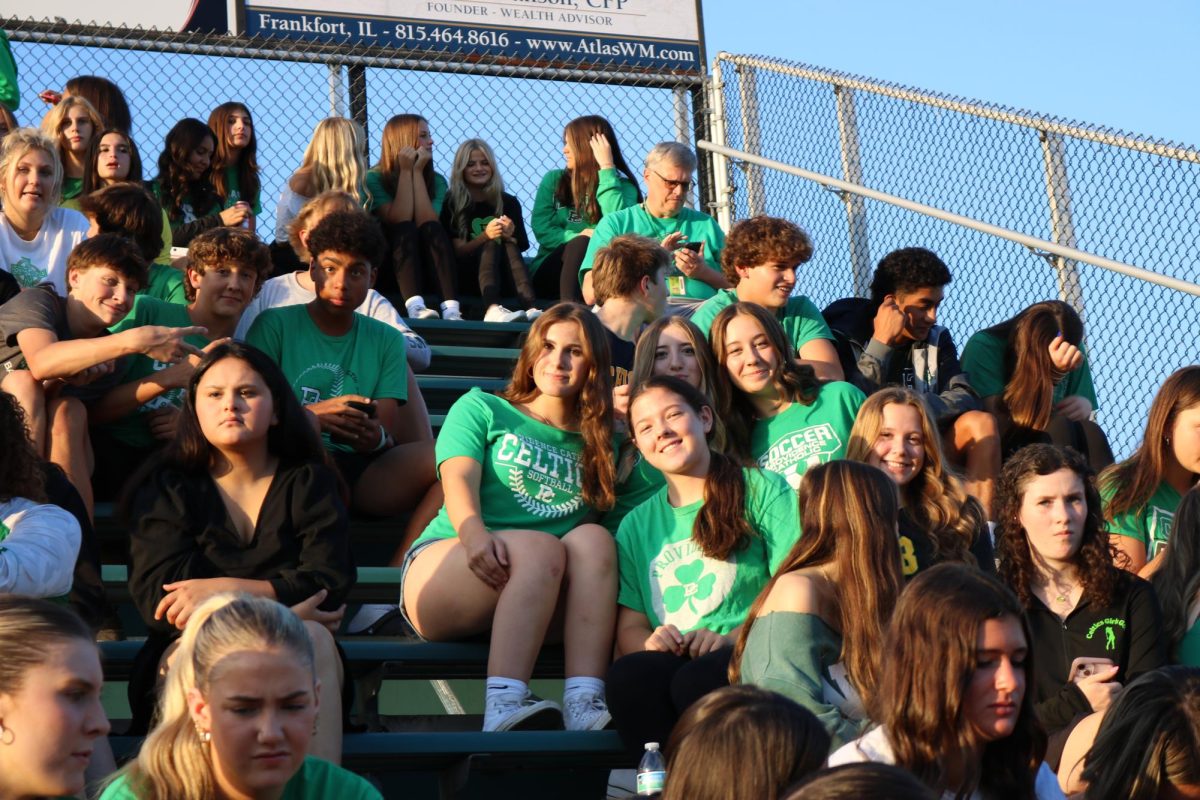 The student section enjoys time with friends and classmates while cheering on the teams.